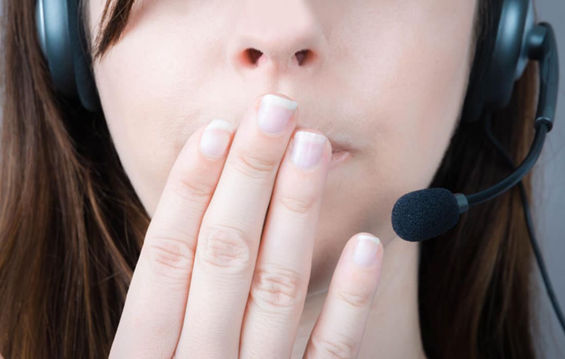 woman-with-hand-over-mouth